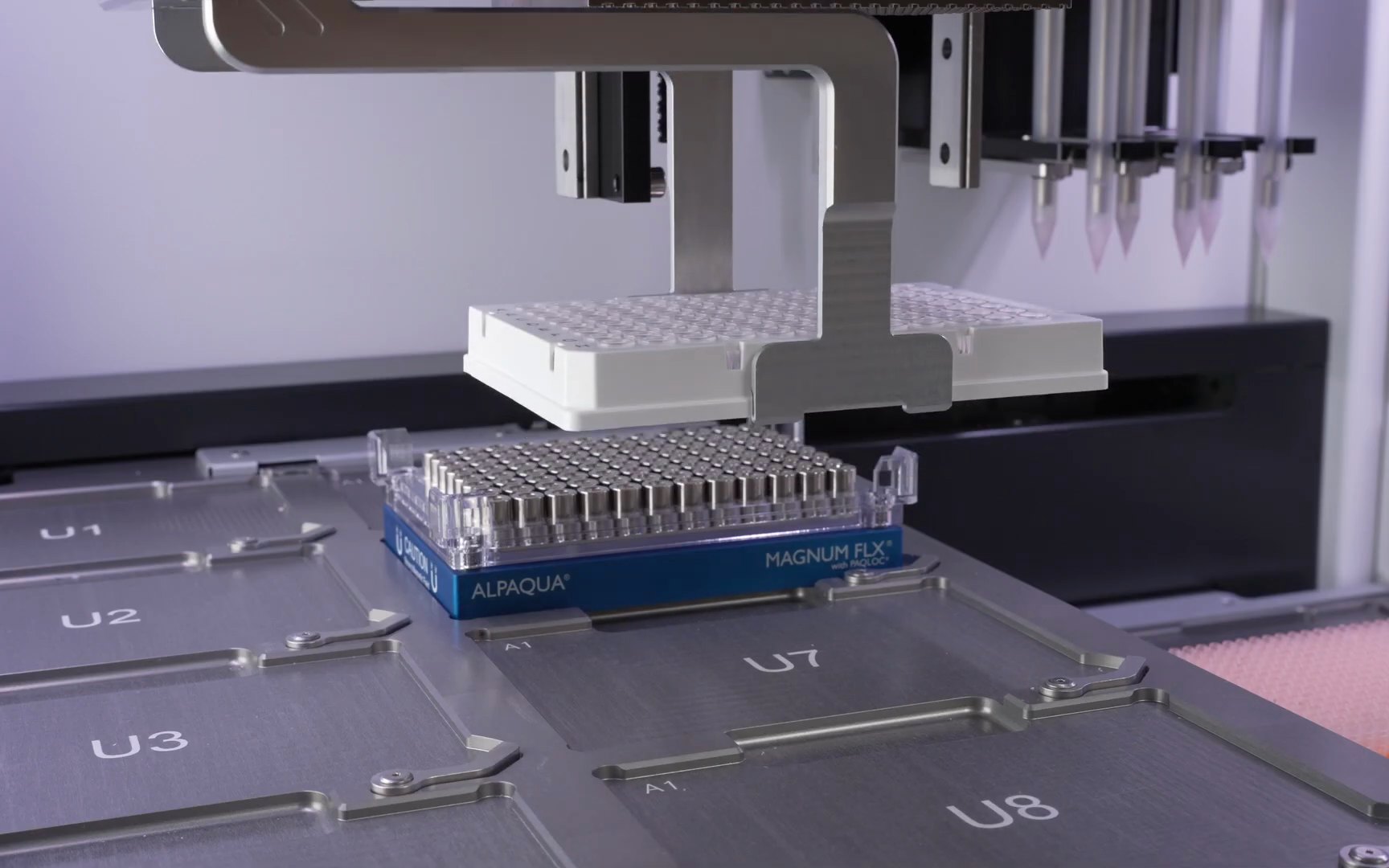 The integrated gripper moving a plate onto a magnet on the deck