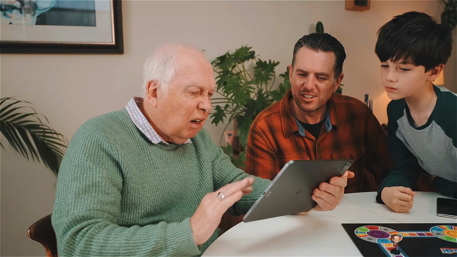 Three generations answering together on the tablet