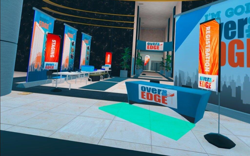 The branded lobby, with registration and staging banners as at a real event
