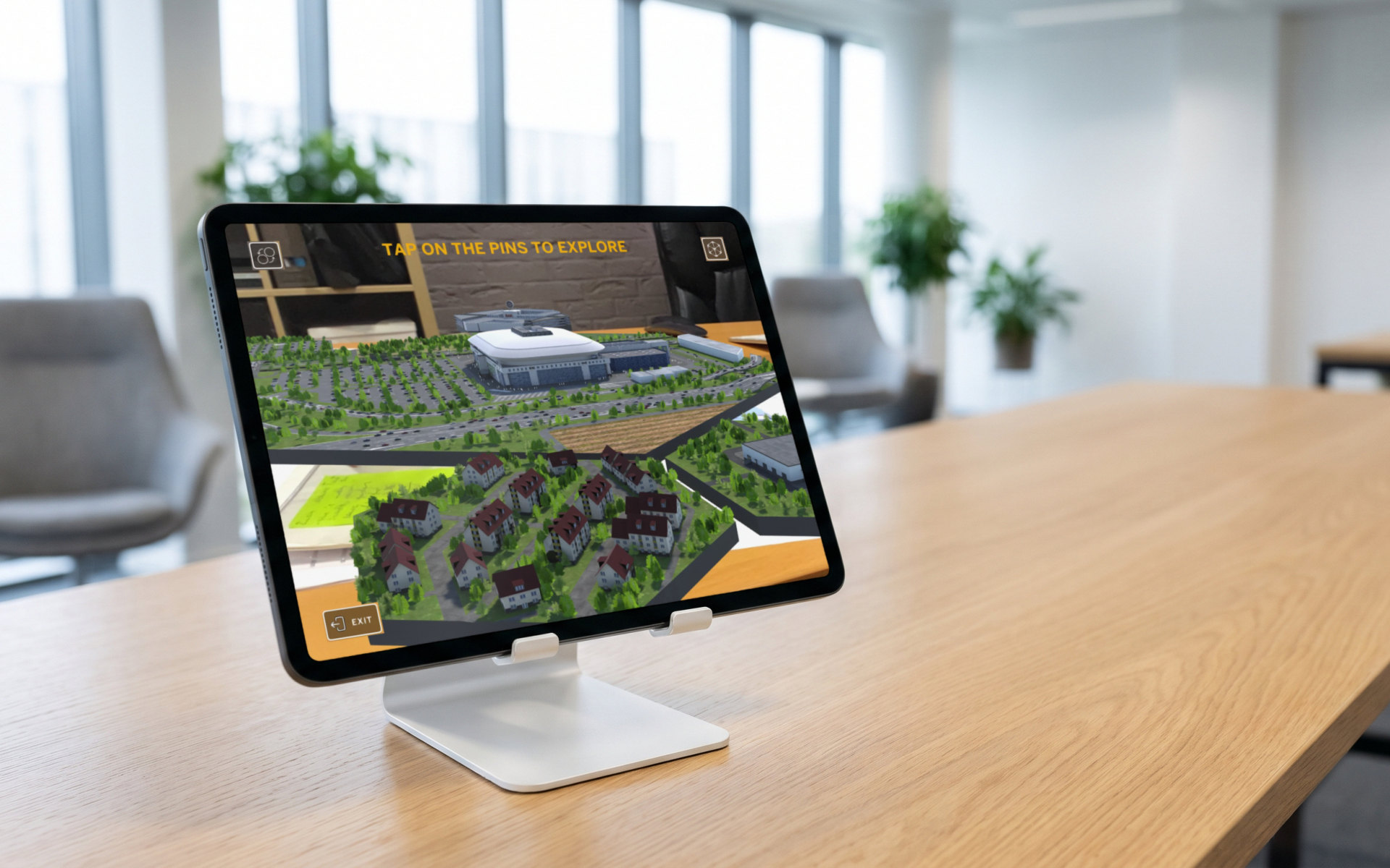A real capture of the app’s AR view, the model on a desk with its ‘Tap on the pins to explore’ prompt, shown on a tablet. The stand and the meeting room are AI-generated
