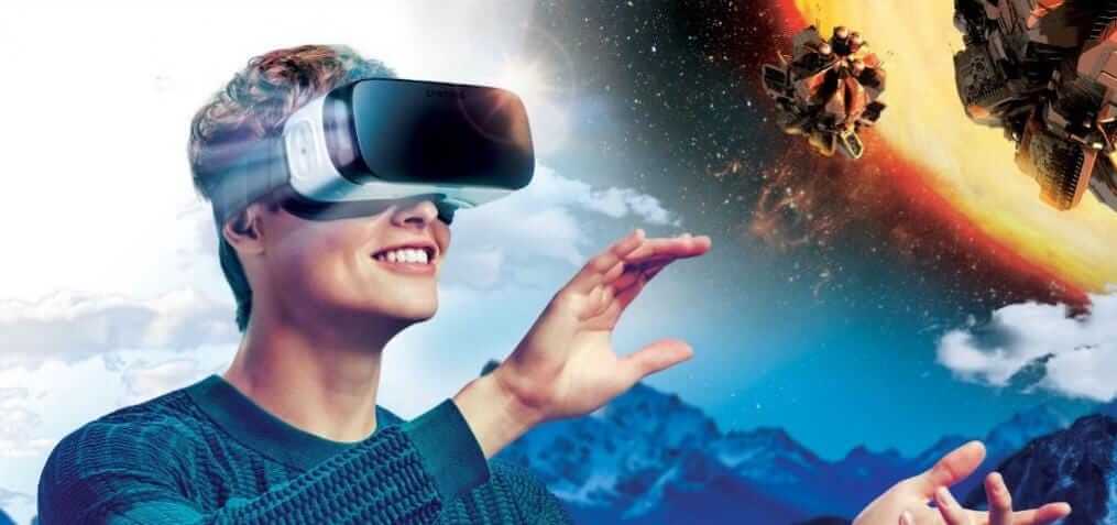 Smiling man in a mobile VR headset reaching out towards asteroids in space